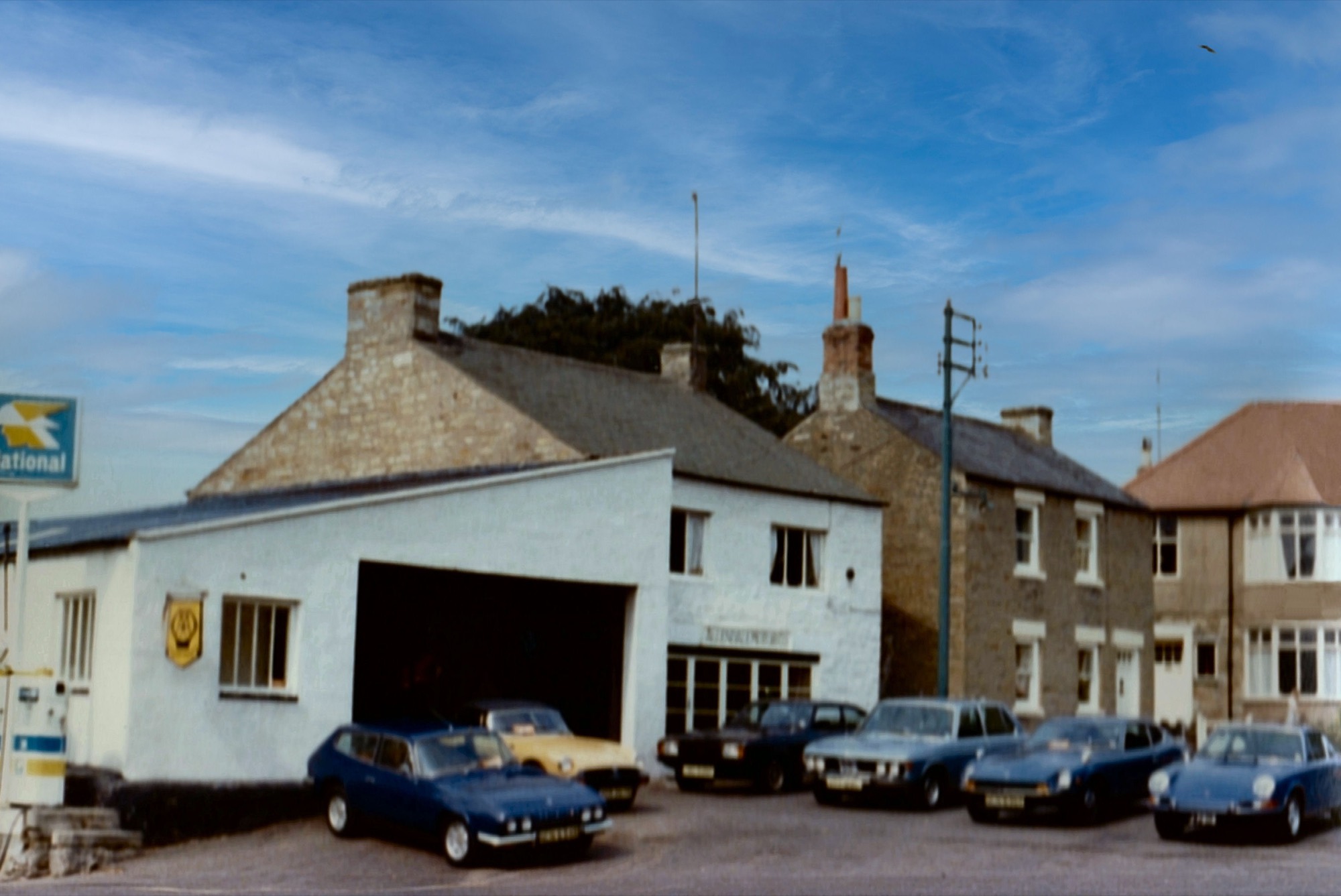 The Allendale Motor Company forecourt in Allendale village square in the 1970s, cars lined up outside the garage