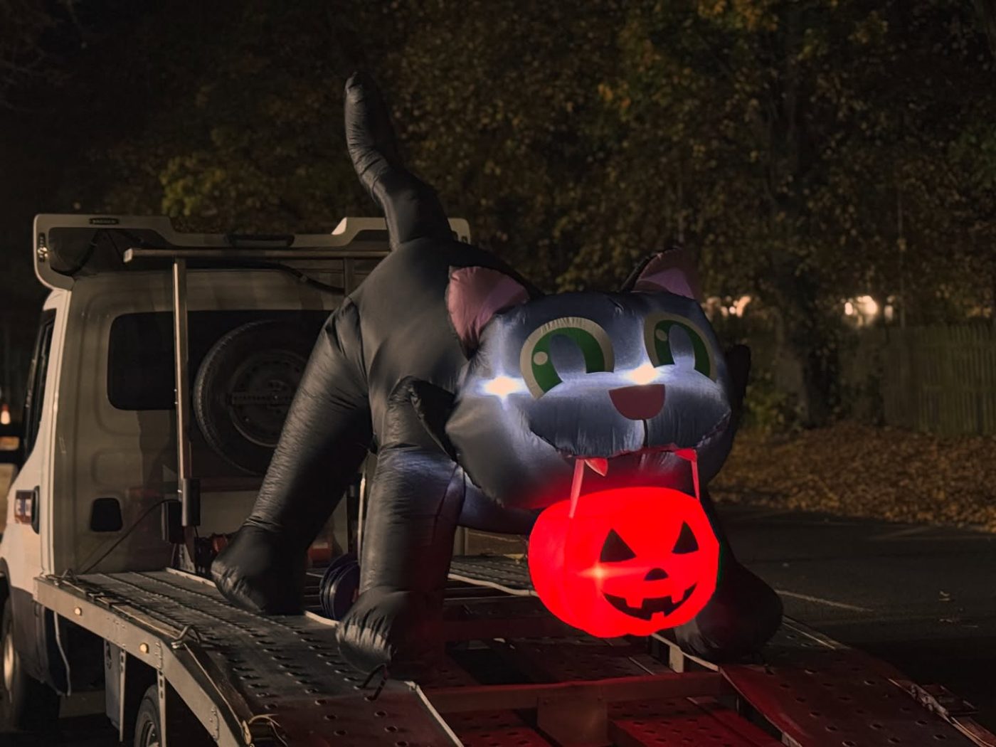 The inflatable Halloween cat riding the We Buy Cars recovery truck