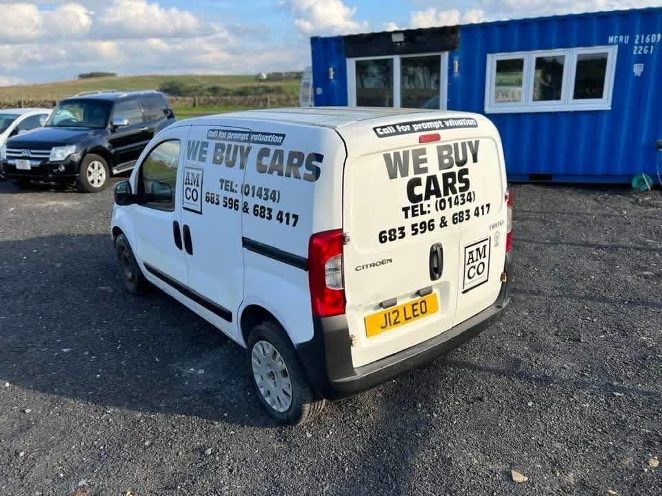 The J12 LEO van outside the converted shipping container We Buy Cars was run from, We Buy Cars written bigger than the Allendale Motor Company badge