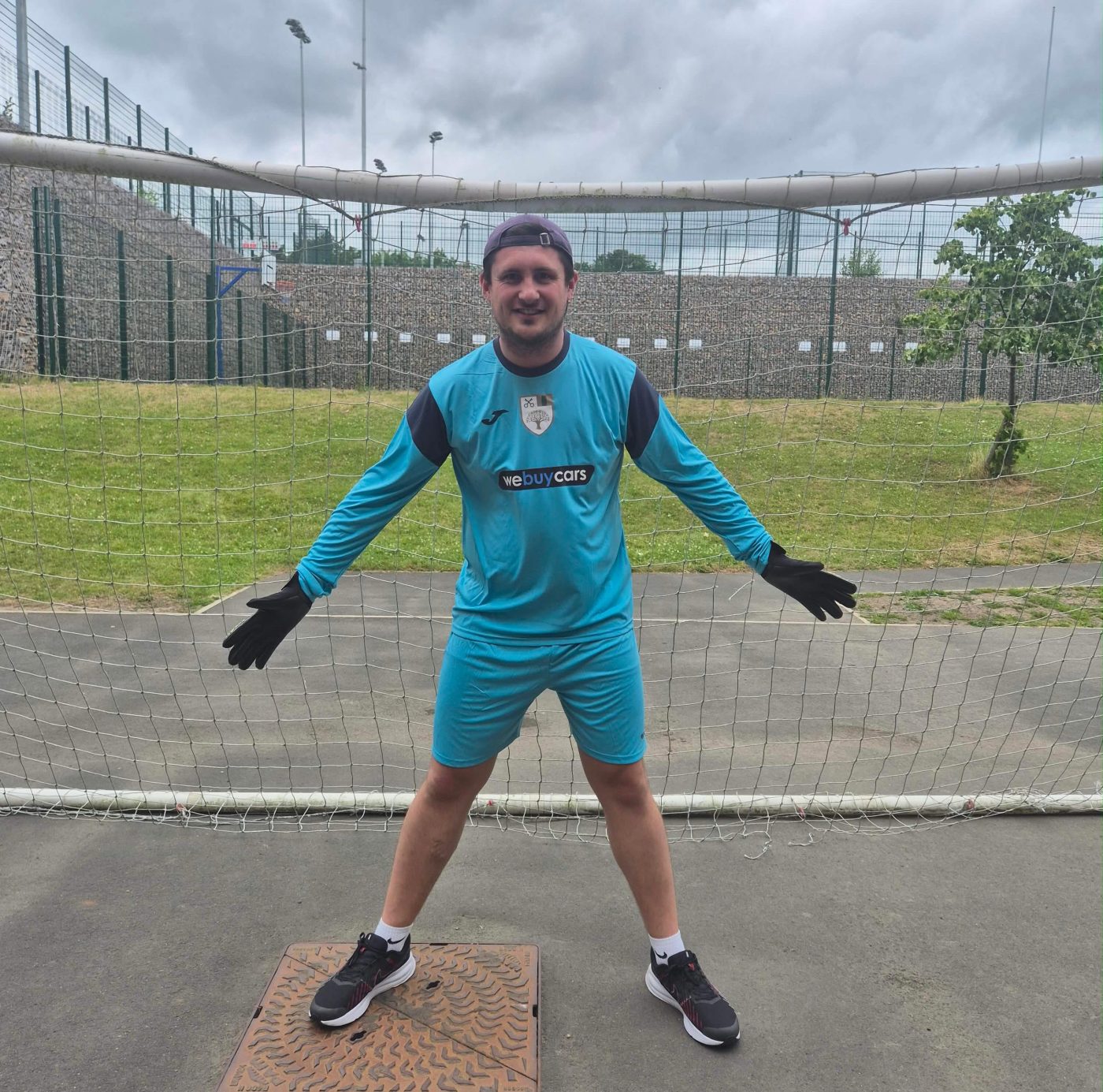 A sponsored goalkeeper kit in the We Buy Cars colours