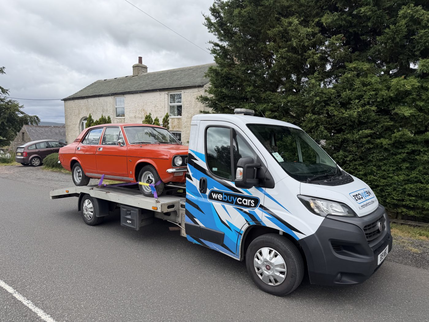 The We Buy Cars transporter today with a 1970s classic car aboard