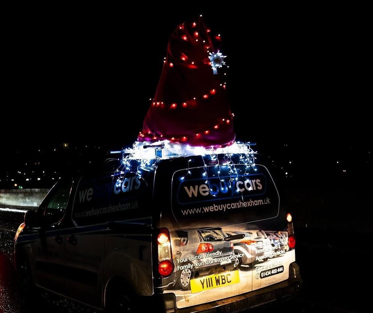 The little recovery truck in its light-up Santa hat at the Christmas convoy