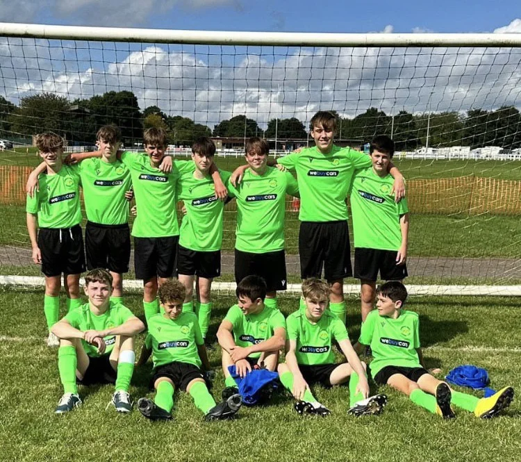 Corbridge United Junior Football Club in their We Buy Cars Hexham sponsored bright green away kit at Tynedale Park
