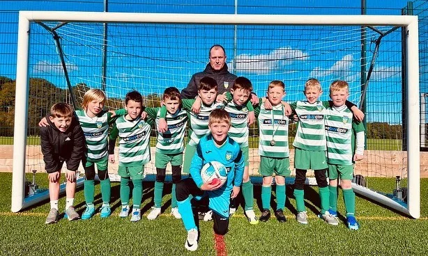 Hexham Juniors Football Club team photo with their We Buy Cars Hexham sponsored kits